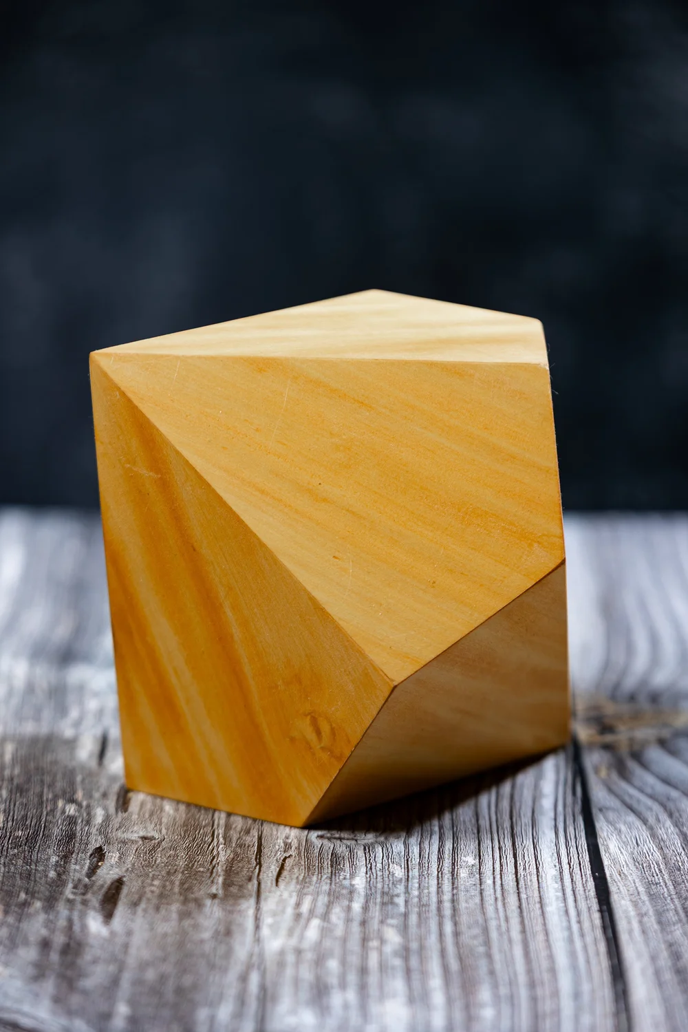 Handcrafted geometric wooden art piece — one example of a past raffle prize